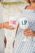 A group of acrylic wine glasses are customized with monograms and custom wording