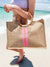 A bamboo jute bag is customized with a pink and melon stripe and monogram 